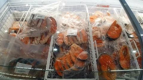 Vacuum Packed Freezed Salmon At a Grocery Store Stock Footage