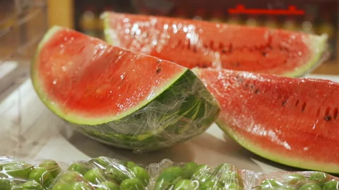 Vacuum-packed fresh fruit on the store shelf in the supermarket Stock Footage 244460276