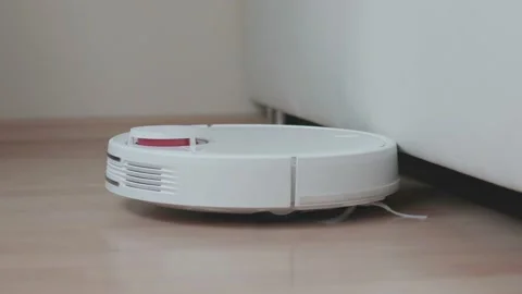 Vacuum robot can not get under furniture, keeps rotating Video stock 146599679