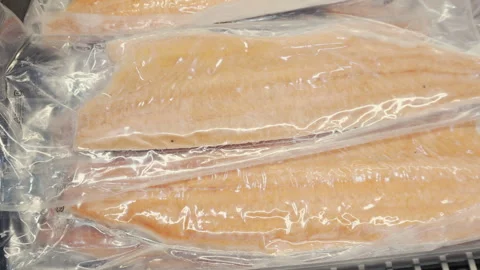 Vacuum Sealed Fish Fillets in Freezer Display Close Up Stock Footage 342391284