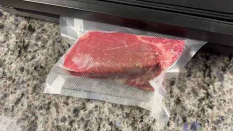 Vacuum Sealing Steak Stock Footage 318987608