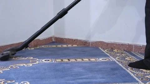 Vacuuming Blue Patterned Carpet In Mosque Stock Footage 334778974