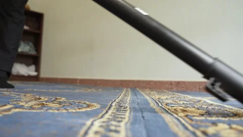 Vacuuming Blue Patterned Mosque Carpet Close Up Stock Footage 335967108