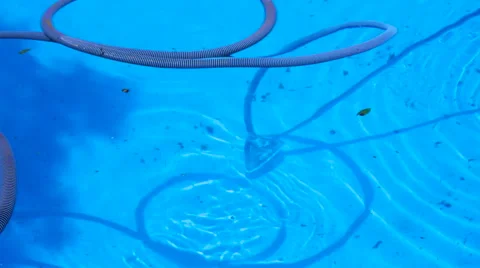Vacuuming the Bottom of a Swimming Pool Stock Footage 64050765