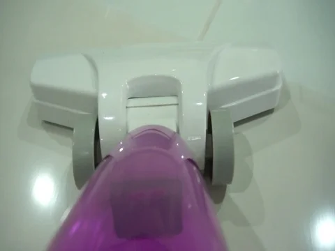 Vacuuming the floor Video stock 104686130