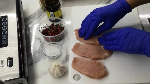 Vacuuming of meat products Stock Footage 228612792