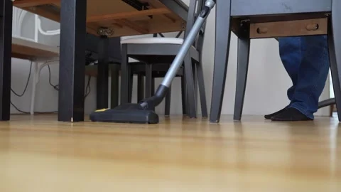 Vacuuming parquet floor Stock Footage 253491099