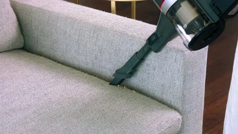 Vacuuming the sofa Video stock 224368125