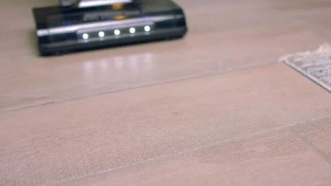Vacuuming tiled floor close-up Stock Footage 139530322