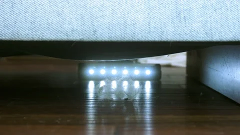 Vacuuming under the sofa close-up Stock-Footage 236302727