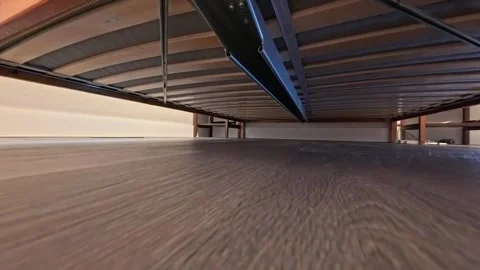 Vacuuming underneath a bed Stock-Footage 318614332