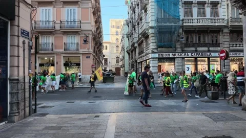 VALENCIA, SPAIN - 2026/09/12: Small group passes historic music society. Stock Footage 345450717