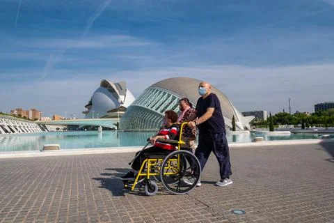 VALENCIA, SPAIN - May 21, 2021: A person in a wheelchair finishes being vacci Stock Photos