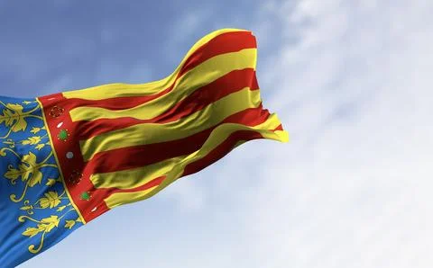 The Valencian Community flag waving in the wind on a clear day Stock Illustration