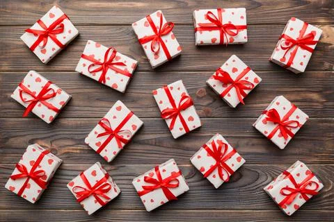Valentine day composition Background: red gift box with bow and heart. Christ Stock Photos