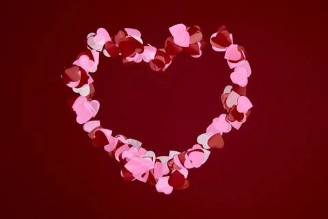 Valentine day composition. Confetti, envelope postcard with hearts on red b.. Stock Photos