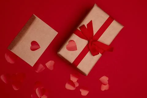 Valentine day composition with copy space. Present or gift box wraped in craf Stock Photos