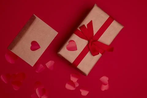 Valentine day composition with copy space. Present or gift box wraped in craf Stock Photos