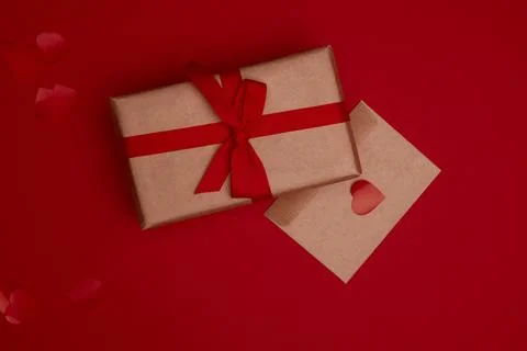 Valentine day composition with copy space. Present or gift box wraped in craf Stock Photos