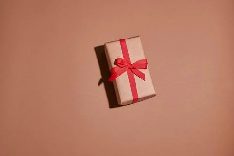 Valentine day composition. Present or gift box wraped in craft paper with h.. Stock Photos