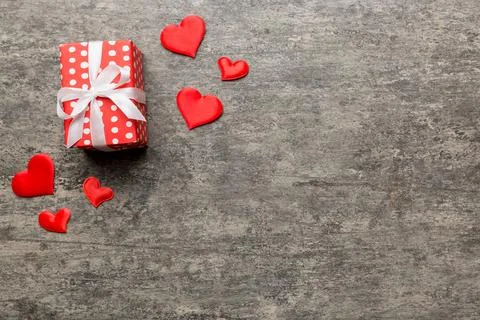 Valentine day composition: red gift box with bow and heart. Christmas present Stock Photos