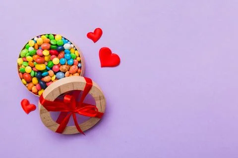 Valentine day composition: sweet candy, with gift boxes with bow and red felt Stock Photos