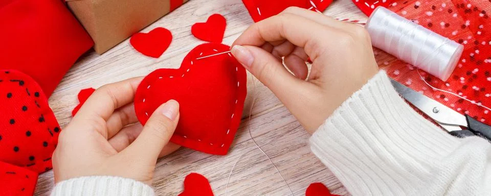Valentine day theme. Workplace for preparing handmade decorations. Top view.. Stock Photos