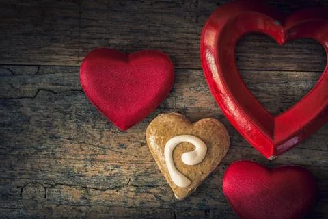 Valentine hearts of different materials on a vintage wooden background Stock Photos