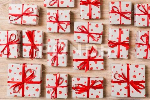 Valentine or other holidays concept. Lots of Gift boxes on wood background to Stock Photos