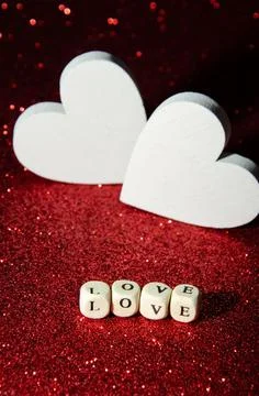 Valentines day abstract background. Selective focus letters on cubes Love. Stock Photos