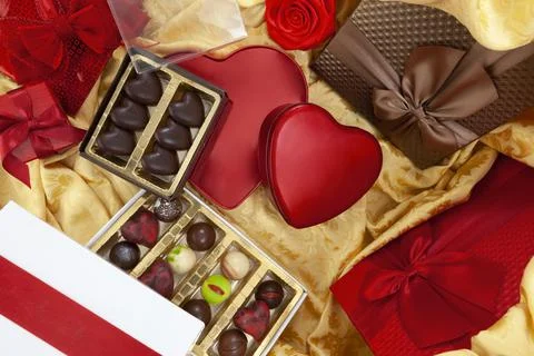 Valentines day background, composition of gift packages chocolates and red he Stock Photos