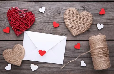 Valentine's day background with decoration. Composition on grey wooden table. Stock Photos