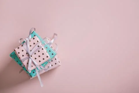 Valentine's Day background. Gift boxes with ribbons on pink background. Valen Stock Photos