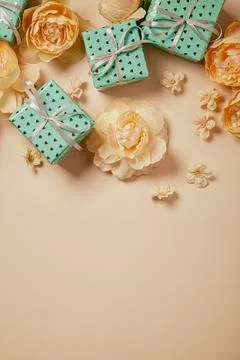 Valentine's Day background. Gift boxes with ribbons and roses on peach backgr Stock Photos