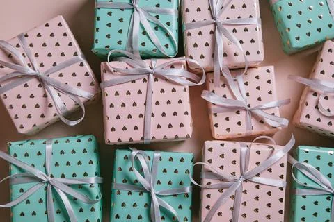 Valentine's Day background. Gift boxes with ribbons on pink background. Valen Stock Photos