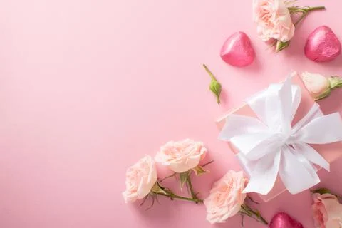Valentine's Day background. The layout of a postcard with a gift, roses and.. Stock Photos