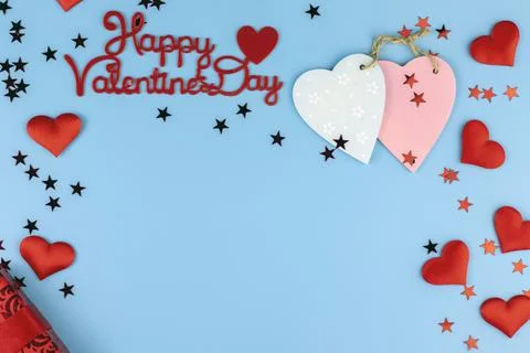 Valentine's day background. Red hearts on a pastel blue background, copy spac Stock Photos