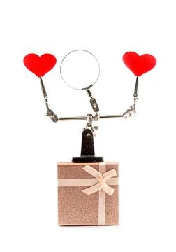Valentines Day background with tool third hand holding hearts and gift Foto stock