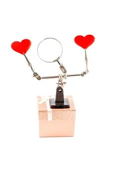 Valentines Day background with tool third hand holding hearts and gift Foto stock
