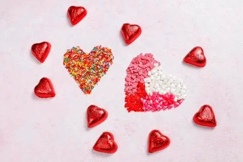 Valentines day background,heart shaped candies,sprinkles,chocolates,top view Stock Photos