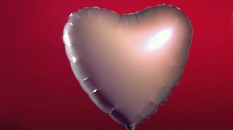 Valentine's Day balloon shot by arrow Stock Footage 61663451