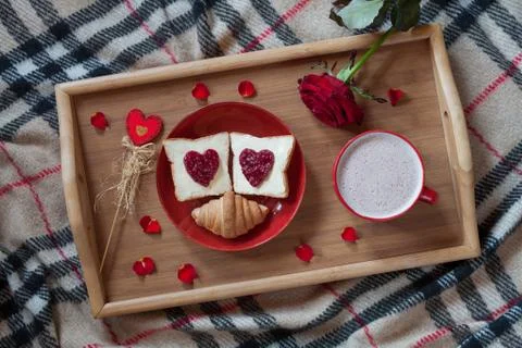 Valentines day breakfast in bed sweet romantic present, red rose flower Stock Photos