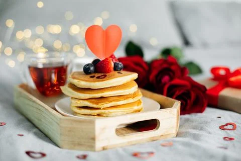 Valentine's day composition with breakfast, gift box and roses. Stack of de.. 写真素材
