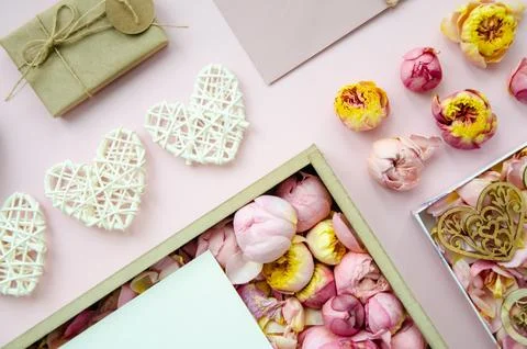Valentine's Day composition. Flat lay of white hearts, handmade gift boxes. Stock Photos