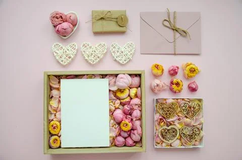 Valentine's Day composition. Flat lay of white hearts, handmade gift boxes Stock Photos