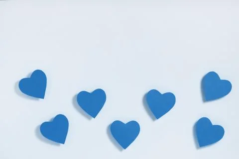 Valentine's day composition. Frame made of paper blue hearts. Flat lay, top v Stock Photos