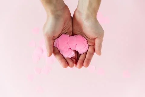 Valentines day composition. Pink background with pink confetti Stock Photos