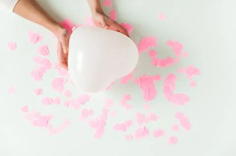 Valentines day composition. White background with white heart shape baloon .. Stock Photos