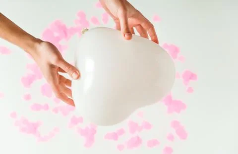 Valentines day composition. White background with white heart shape baloon .. Stock Photos