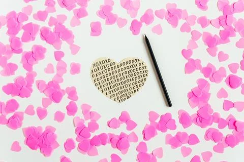Valentines day composition. White background with pink confetti, hand drawn.. Stock Photos
